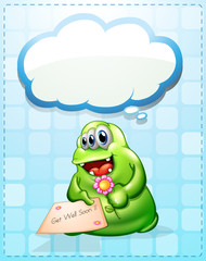 A cheerful green monster holding a card and a flower