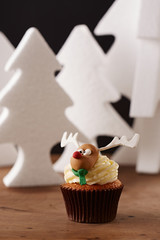 Rudolph cupcake on Christmas background