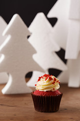 Red velvet cupcake on Christmas background