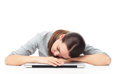 Tired woman sleeping on laptop