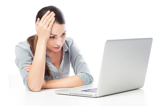 Worried woman using laptop