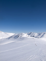 Fototapeta na wymiar Winter hiking and langlauf trail in the alps