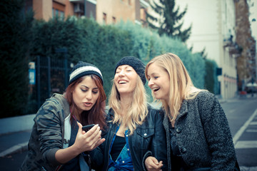 three friends woman on the phone