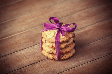 Cookies with christmas gifts on wooden table