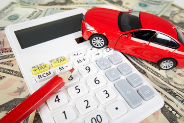 Car money and calculator.