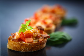 bruschetta with cheese and tomatoes