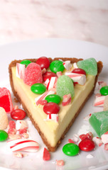 Fototapeta na wymiar Festive Christmas Cheesecake with assorted candies