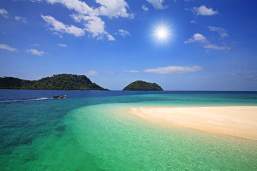 Andaman sea and white sand against sunbeam