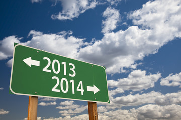 2013, 2014 Green Road Sign Over Clouds