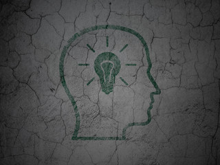 Information concept: Head With Lightbulb on grunge wall