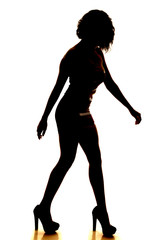 Fototapeta na wymiar silhouette woman walking side