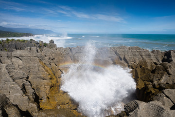 Pancake rock splash water and rainbow, Punakaiki