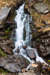 Fototapeta premium Beautiful autumn waterfall