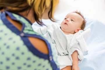 Babygirl Looking At Mother In Hospital