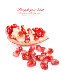 pomegranate seeds over white background