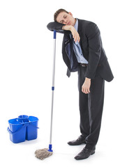 Businessman or banker responsible for mess and sleeping on mop