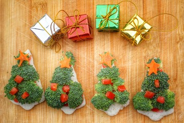 Christmas tree of bread  broccoli and tomatoes