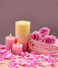 Obraz na płótnie Canvas spa set with rose and candle on mat