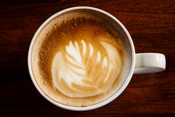 Flat white coffee with latte art.Top view.