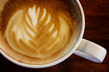 Flat white coffee with latte art.Top view.