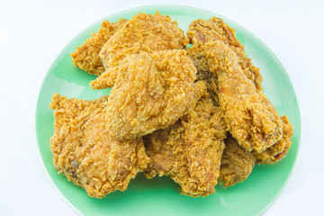 fried chicken on a plate with white background