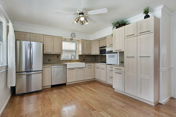 Kitchen with tan cabinetry