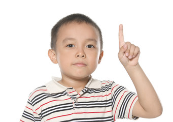 a cute little boy pointing upward