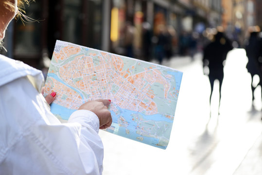 Tourist looking at City map