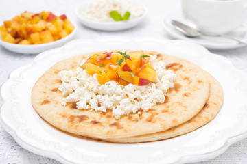 Flat bread with cottage cheese with honey, nuts, fresh peaches