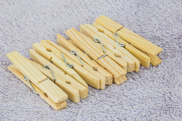 A bunch of clothes peg and laundry in a wicker basket