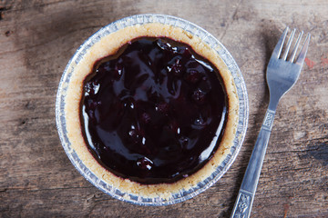 blueberry pie on wood
