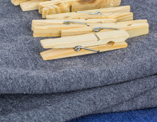 A bunch of clothes peg and laundry in a wicker basket