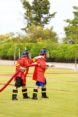Obraz na płótnie Canvas Firefighter fighting for fire attack training 