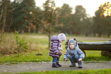 Two sisters playing outdoors