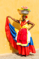 Lady selling fruits in Cartagena, Colombia - obrazy, fototapety, plakaty