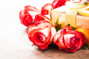 Gift box and bouquet of roses