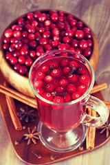 Hot drink with cranberries for Christmas