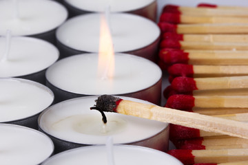 matches ignited white candles