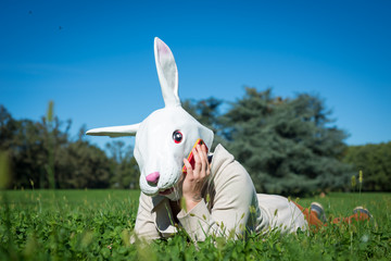 young hipster rabbit mask woman on the phone