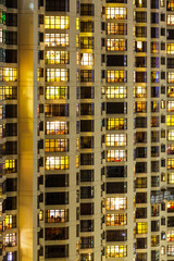Fototapeta na wymiar Exterior of apartment building at night