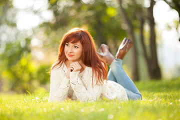 Young pretty woman relaxing in the park