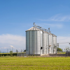 beautiful silver silos in landscape © travelview