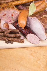 cured meat products on a wooden table
