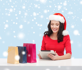 woman with gift box and tablet pc computer