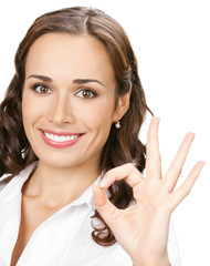 Businesswoman with okay gesture, isolated