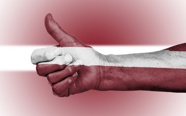 Old woman giving the thumbs up sign
