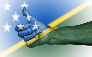 Old woman giving the thumbs up sign