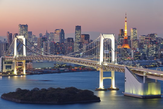 View of Tokyo City at night with Rainbow Bridge and Tokyo Tower