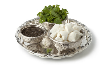 Traditional Moroccan bowls with sugar,mint and tea