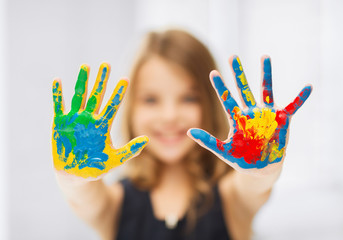 girl showing painted hands